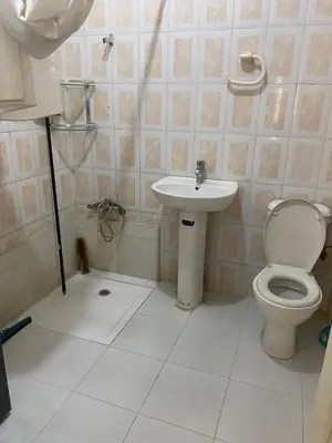 a bathroom with a toilet and a sink at Azrou in Azrou