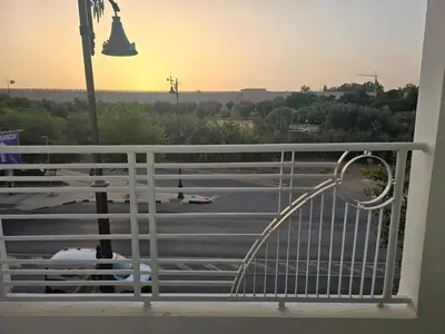a balcony with a view of a parking lot at belle vue à petit prix in Meknès