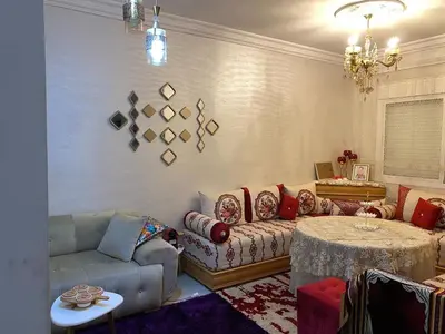 a living room with a couch and a table at Dar Tranquila in Fès