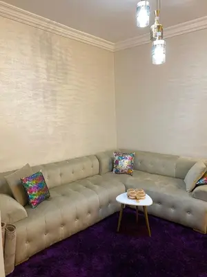 a living room with a couch and a table at Dar Tranquila in Fès