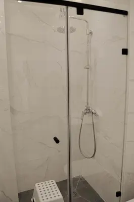a shower with a glass door in a bathroom at Perfect Stop in Midelt in Midelt