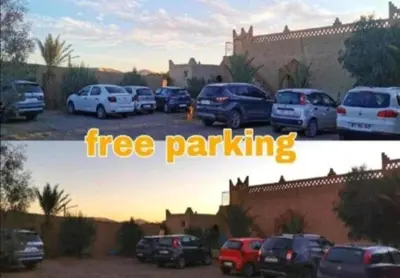 a group of cars parked in a parking lot at Luxury Sahara Gold Camp in Merzouga