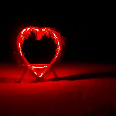 a red heart shaped light sitting on a table at Luxury Sahara Gold Camp in Merzouga