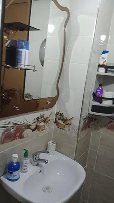 a bathroom with a sink and a mirror at Reda Ghazalie in Meknès