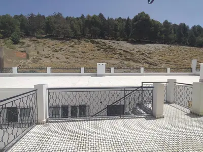 a balcony with a fence on top of a building at Apartement khadija in Azrou