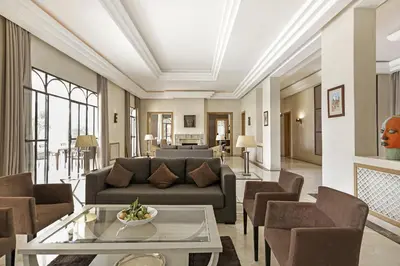a living room with a couch and chairs at Mexance Villa with large hosting capacity, private heated pool, Fitness and SPA in Oulad Mazoug