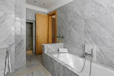 a bathroom with a bath tub in a room at Mexance Villa with large hosting capacity, private heated pool, Fitness and SPA in Oulad Mazoug