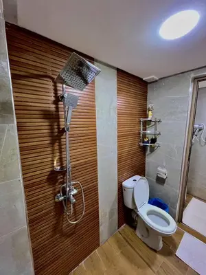 a bathroom with a shower and a toilet in it at Dar Al Batoul Meknes in Meknès
