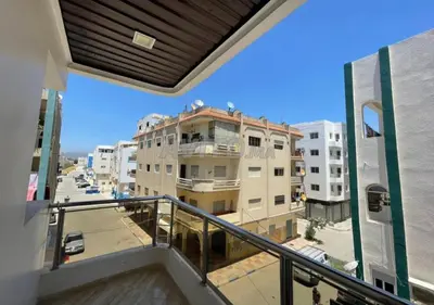 a balcony with a view of a building at Saada in Fès