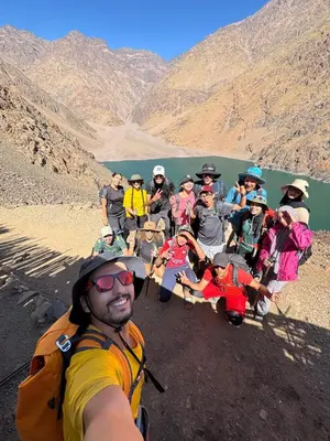 a group of people posing for a picture on a mountain at Berber lodge amssouzart in Tizgui