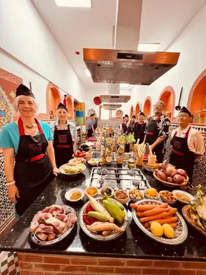 a group of people standing around a buffet of food at Riad Fes Bab Sahra Palace in Fès
