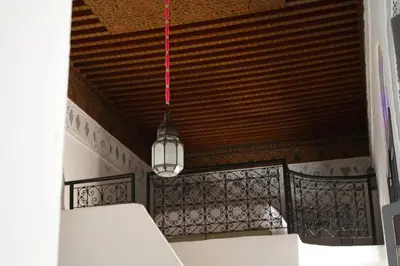 aendant light hanging from a ceiling in a room at Riad Yamcha in Meknès