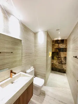 a bathroom with a toilet and a sink at Ennaim Garden Loft in Oulad Akkou