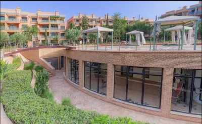 an external view of a building with a courtyard at Ennaim Garden Loft in Oulad Akkou