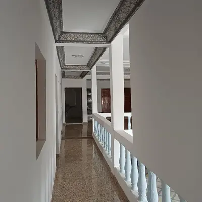 a hallway of a house with a coffered ceiling at La Belle Vue Guest House in Aït Ben Haddou