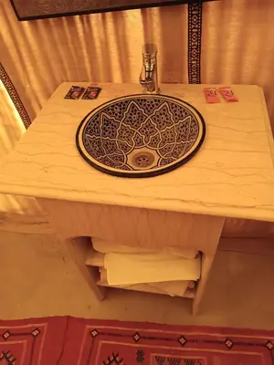 a table with a sink on top of it at enjoy best night in desert merzouga in Merzouga