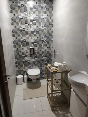 a bathroom with a toilet and a sink at Apartment Sea view Toudert Anza Agadir in Oulad Akkou