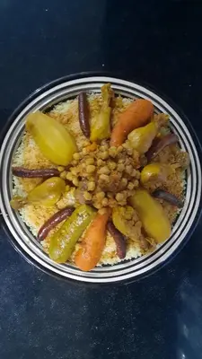 a plate of food with vegetables on a table at Villa Roseaux heated pool Marrakech in Najem