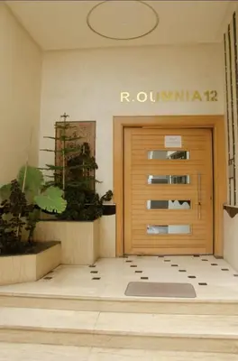 a front door of a building with a mat in front of it at Smart home oumnia in Fès