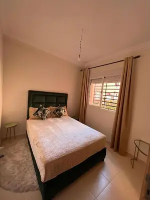 a bedroom with a bed and a window at sale in Oulad Akkou