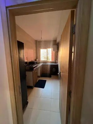 a kitchen with a door open to a kitchen with a sink at sale in Oulad Akkou
