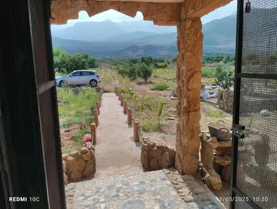 a view from the door of a house with a garden at Authentic Guesthouse with Garden and Mountain View Beni Mellal in Beni Mellal
