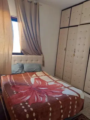 a bedroom with a bed with a blanket on it at مكناس مريم in Meknès