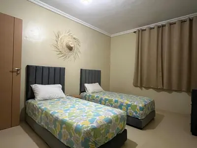 a room with two beds and a window at Appartement de 3 chambres pour 6 voyageurs à 20 minutes de centre ville de Marrakech in Azib Oulad Lâdem
