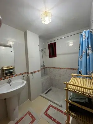 a bathroom with a sink and a shower at Appartement de 3 chambres pour 6 voyageurs à 20 minutes de centre ville de Marrakech in Azib Oulad Lâdem