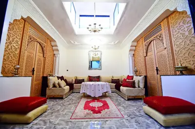a living room with a couch and a table at DAR El Ghali in Fès