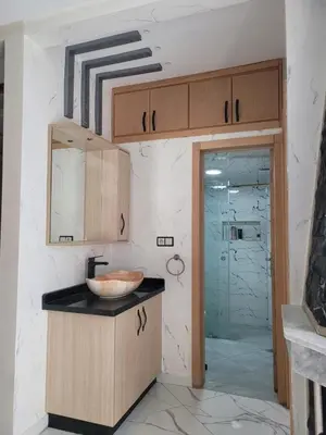 a bathroom with a sink and a counter top at Bella Nova Air-Conditioned Apartment in Azrou