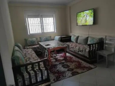 a living room with a couch and a table at sabri in Beni Mellal