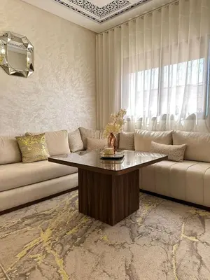 a living room with a couch and a table at Chic & Cozy Apartment for a Comfortable Stay Fes in Fès