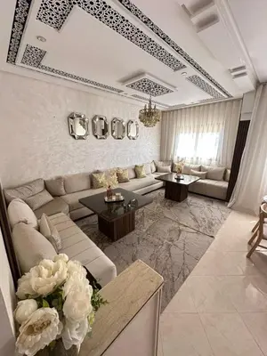a large living room with a couch and tables at Chic & Cozy Apartment for a Comfortable Stay Fes in Fès