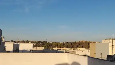 a view of a city from the roof of a building at City escapade apartement in Fès