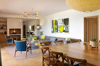 a living room with a table and a couch at Salamouni Villa ideal for family, 4-6 chambres, 8-12 personnes in Oulad Snaguia