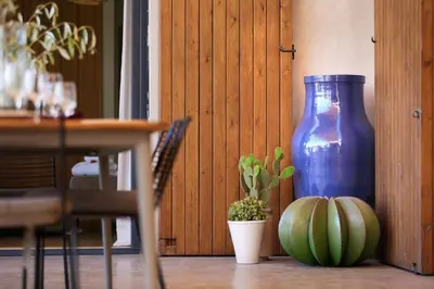 a blue vase sitting next to a plant and a pumpkin at Salamouni Villa ideal for family, 4-6 chambres, 8-12 personnes in Oulad Snaguia