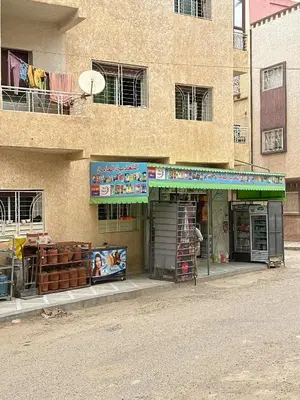 a store on the side of a building at Appartement calme et spacieuse in Meknès