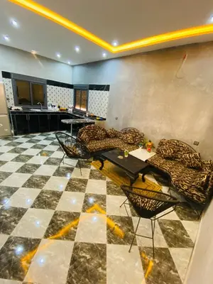 a room with a checkered floor and tables and chairs at Casa Kush in Sidi Bouzguia