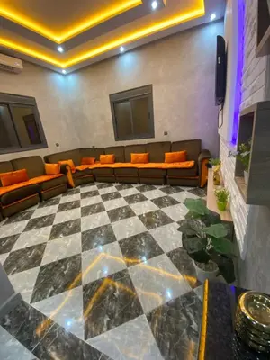 a lobby with couches and a checkered floor at Casa Kush in Sidi Bouzguia