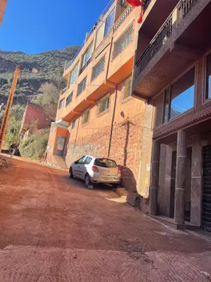 a car parked in front of a building at Family house in Ourika
