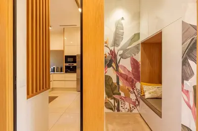 a hallway with a door with a painting on the wall at Villa Belkis, games, Hammam, swimming pool, not overlooked in Oulad Akkou
