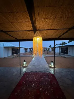 a large chandelier hanging from the ceiling of a building at lunara camp in Merzouga