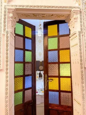 a door with a bunch of colorful glass at Dar Noor Fès in Fès
