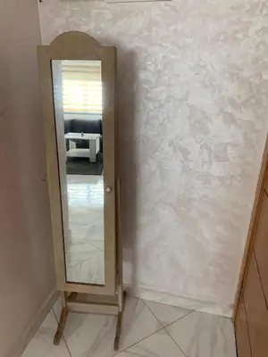 a mirror on a wall in a room at prestige appartment in Fès