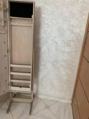 a closet with a white wall and a shelf at prestige appartment in Fès