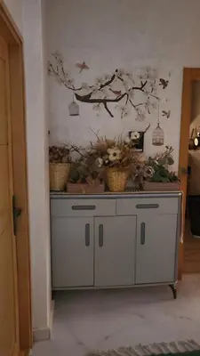 a dresser with two baskets on top of it at Belle appartement in Meknès