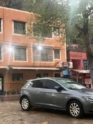 a gray car parked in front of a building at Ôtel Mrrakchi in Irghaf
