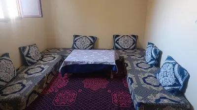 a room with a table and two chairs and a table and chairsuggest at Casa caram in Hassilabied