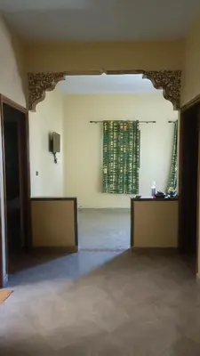 an empty room with a window in a building at Casa caram in Hassilabied